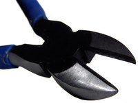 Pliers can assist in both cutting and bending wire when creating a sculpture.