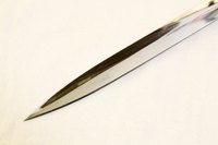 In "Assassin's Creed," Altair conceals a spring-loaded dagger beneath his cloak.