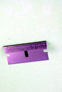 Use a razor blade to slice away old caulk.