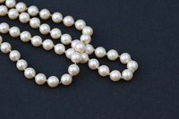 Restring your pearls to keep the necklace from breaking or to repair a broken necklace.