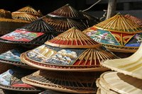 Weave your own conical straw hat.