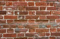Use cement screws to mount curtain rods on brick walls.