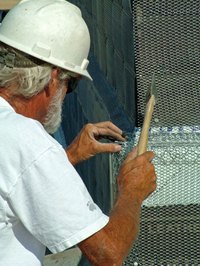 Stucco wire, or wire lath, is installed before the first coat of stucco.