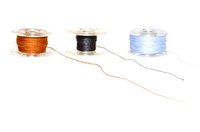 A bobbin caries a small amount of thread that is inserted inside a sewing machine.