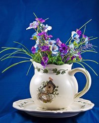 Arrange beautiful silk flowers for your clients from home.