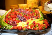 A pretty fruit tray can act as the centerpiece of the food table.