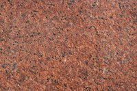 Clean your granite with dish soap and rubbing alcohol.