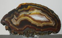 Brown gemstones often look like simple rocks in their raw outer form.
