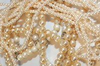 Imitation pearls can be identified through a variety of methods.