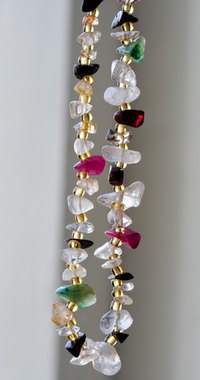 Long necklaces brighten your face and outfit.