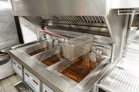 Deep fryer with cooking oil.