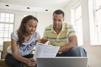 Young couple going over paperwork together