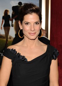 Actress Sandra Bullock sports a glamorous side puff on the red carpet.