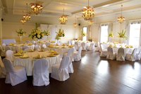 Dinner tables prepared at a reception.