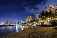 Waikiki lights up at night.