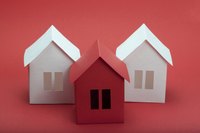 Create paper houses out of different colors of paper.