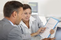 Two colleagues going over a business plan.