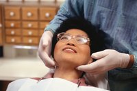 Dentist examining a patient's bite.