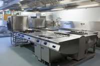 Cleaned restaurant equipment in a kitchen.