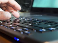 A man is using his laptop.