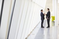 Two business men negotiate.
