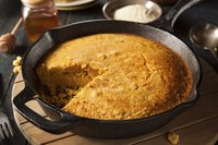 A cast-iron pan fries up Southern cornbread.