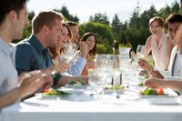 Friends enjoying five-course dinner meal outside