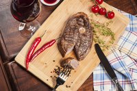 Cooked steak on table cutting board