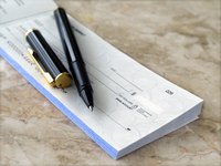 Pen on a checkbook