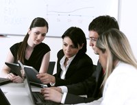 Finance business coworkers looking at company's budget