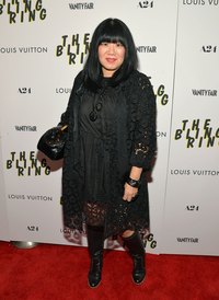 Fashion designer Anna Sui demonstrates how to wear black boots on a fuller body.