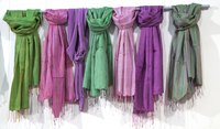 Add a splash of color to your wardrobe with a pastel-hued pashmina scarf.