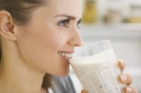 Woman drinking malted shake made with Horlicks