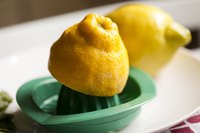 A lemon half on a juicer.