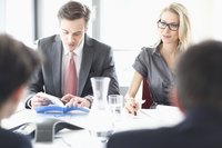 Business meeting discussing company organization
