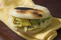 An arepa on a yellow napkin.