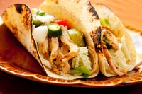 Shred the chicken and serve over tortillas for a mojo take on tacos de cazuela.
