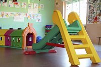 Interior of a day care centre with a slide.