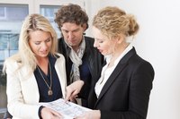 Partners looking over a rental agreement.
