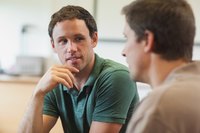 A manager and employee having a discussion in an office.