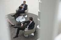 Business workers sitting and talking together.