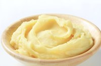 A Cuisnart mashes potatoes quickly, but they'll become gluey if you're not careful.