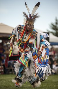 Native American grass dance reglia is elaborate.
