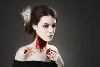 Woman dressed as a vampire's victim.