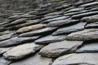 A nylon-bristled brush helps clean dirt out of cracks and crevices in slate.