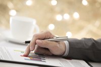 Businessman studying bar graphs and charts
