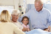 Senior woman in hospice with family