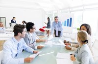 A group of businesspeople attending a board meeting