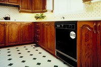 Properly prepared linoleum flooring can support new self-stick tiles.