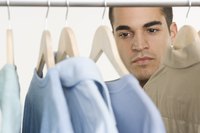 Man looking at his shirts in the closet